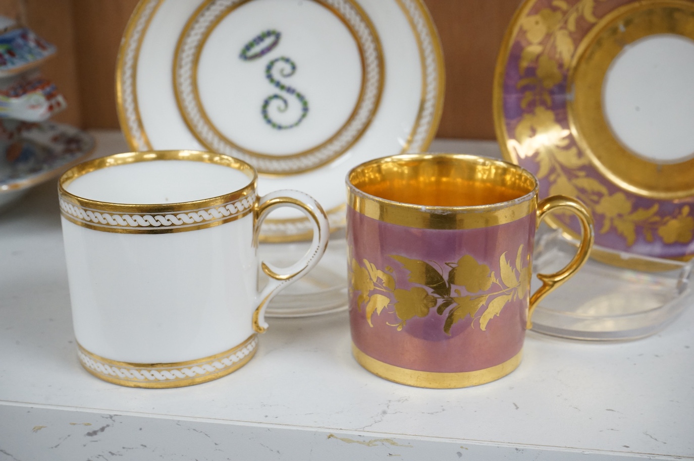 Two 19th century Paris porcelain coffee cans and saucers, cans 6cm high.